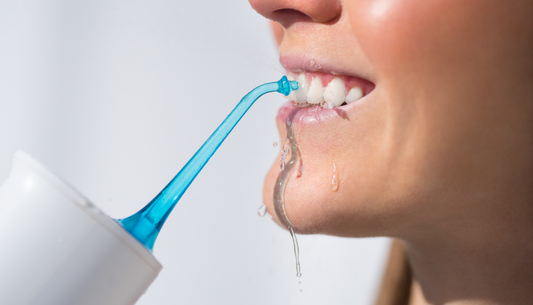 What Are the Benefits of a Water Flosser Compared to Traditional Dental Floss?